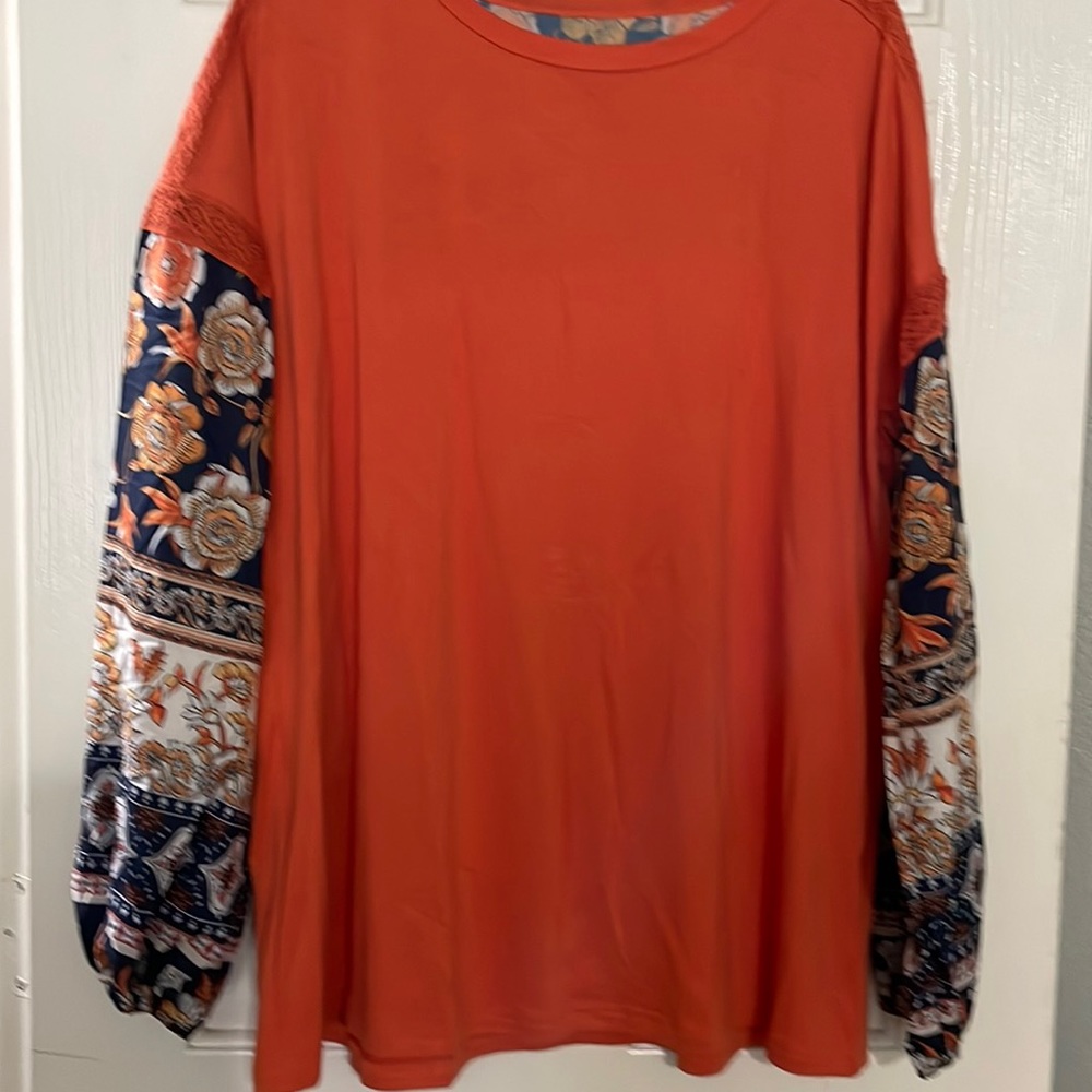 Orange and floral top. Size large. Never worn.